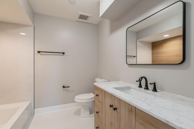 bathroom with toilet and vanity