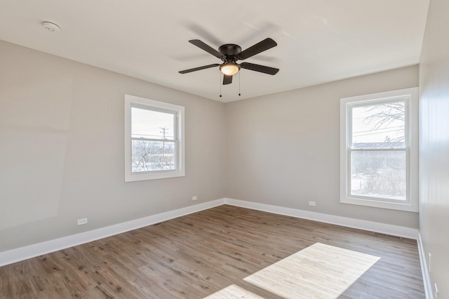 unfurnished room featuring ceiling fan and light hardwood / wood-style flooring