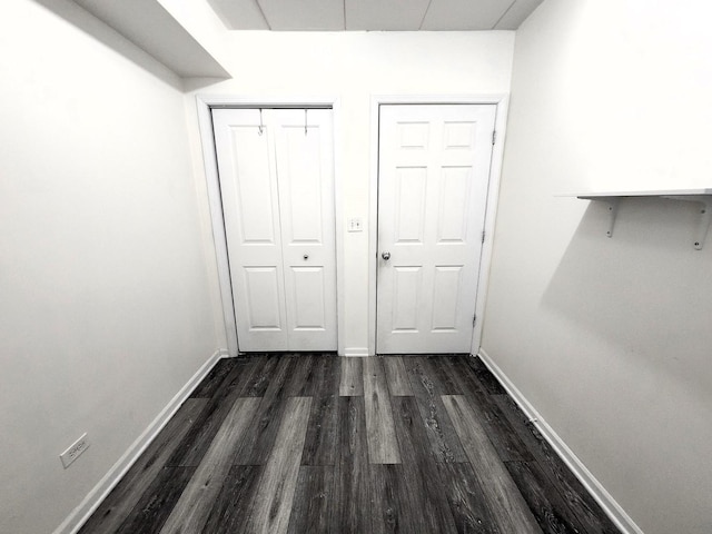 hallway featuring dark hardwood / wood-style floors