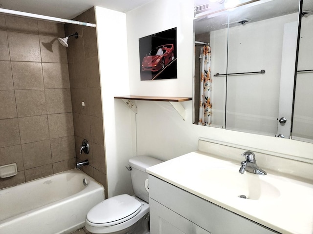 full bathroom featuring shower / bathtub combination with curtain, vanity, and toilet