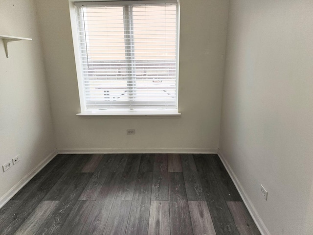 spare room featuring dark hardwood / wood-style flooring