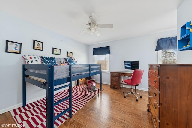 bedroom with hardwood / wood-style flooring and ceiling fan