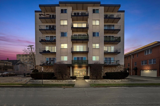 view of outdoor building at dusk