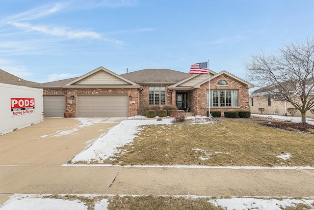 view of front of house with a garage and a front lawn