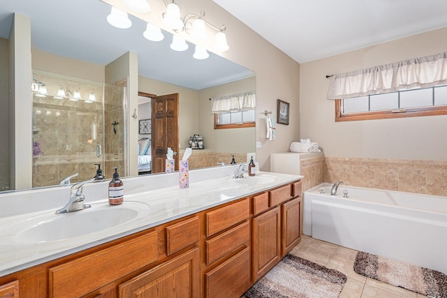 bathroom with plus walk in shower, vanity, and tile patterned flooring