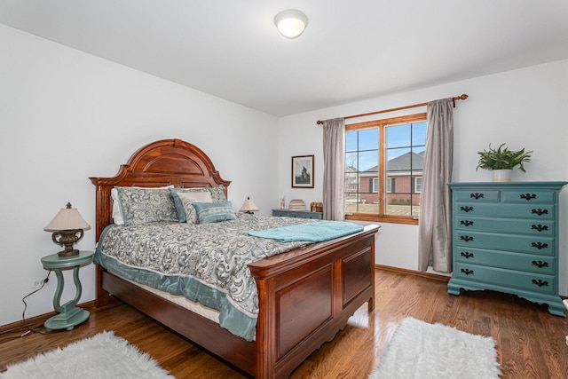 bedroom with wood-type flooring