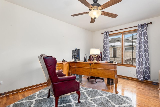 office space with hardwood / wood-style flooring and ceiling fan