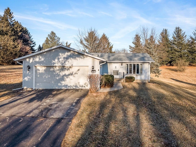 ranch-style home with a garage