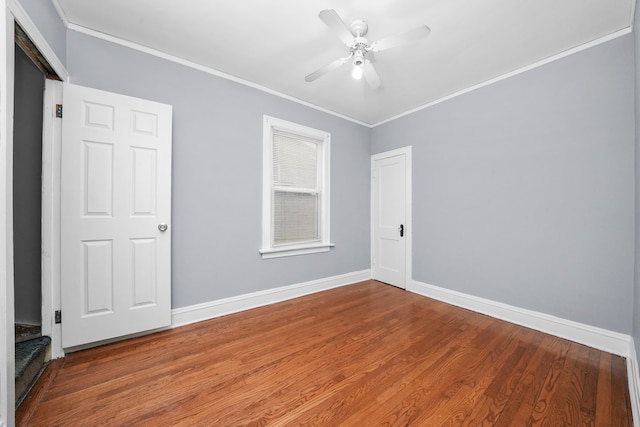 spare room featuring ornamental molding, hardwood / wood-style floors, and ceiling fan