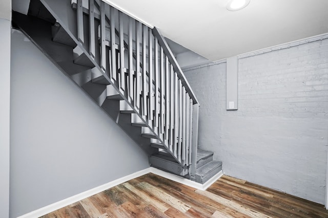 stairway featuring hardwood / wood-style flooring