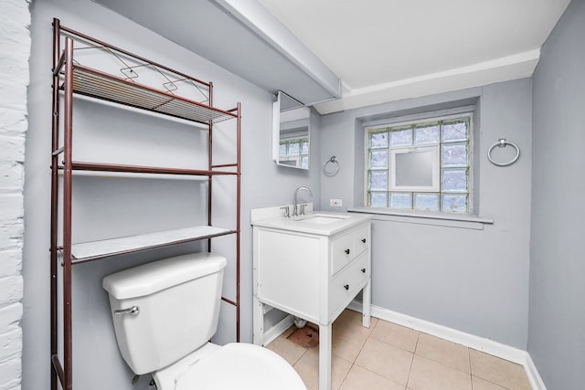 bathroom featuring vanity, tile patterned floors, and toilet