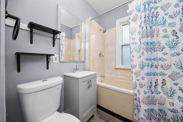 full bathroom with vanity, hardwood / wood-style floors, shower / bathtub combination with curtain, and toilet