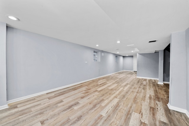 basement featuring light wood-type flooring