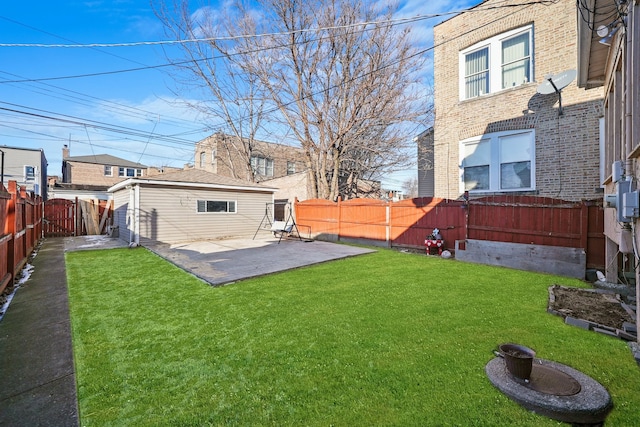 view of yard featuring an outbuilding and a patio area