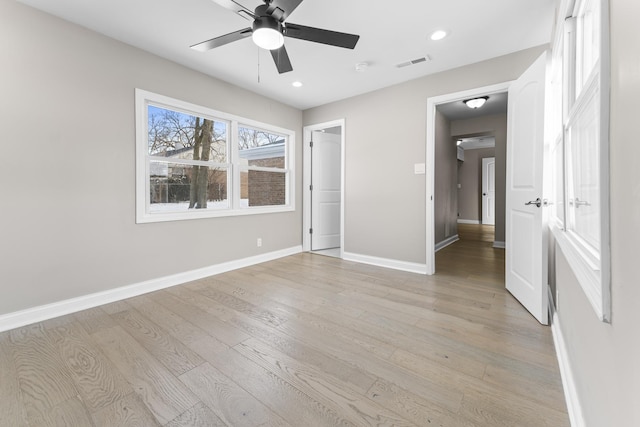 unfurnished bedroom with ceiling fan and light hardwood / wood-style floors