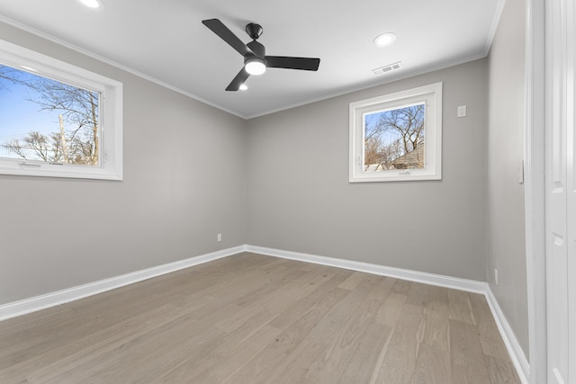 unfurnished room with crown molding, light hardwood / wood-style floors, and ceiling fan