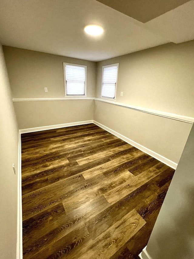 empty room featuring dark wood-type flooring