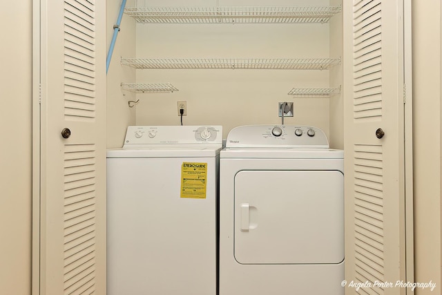 washroom with washing machine and dryer