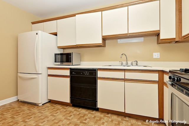 kitchen with sink, stainless steel appliances, and white cabinets