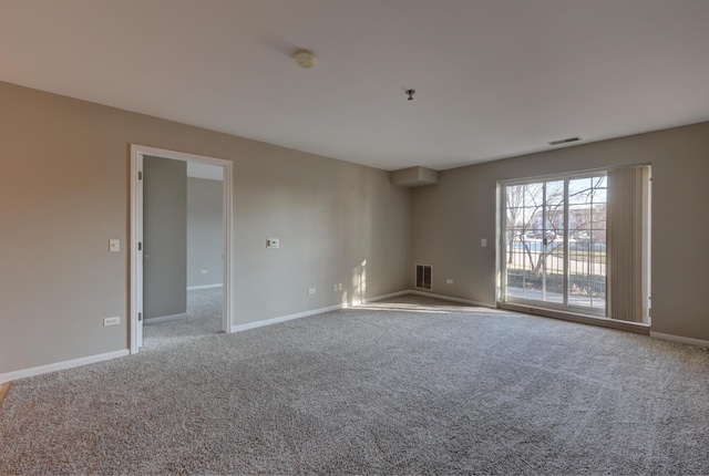 empty room with light colored carpet