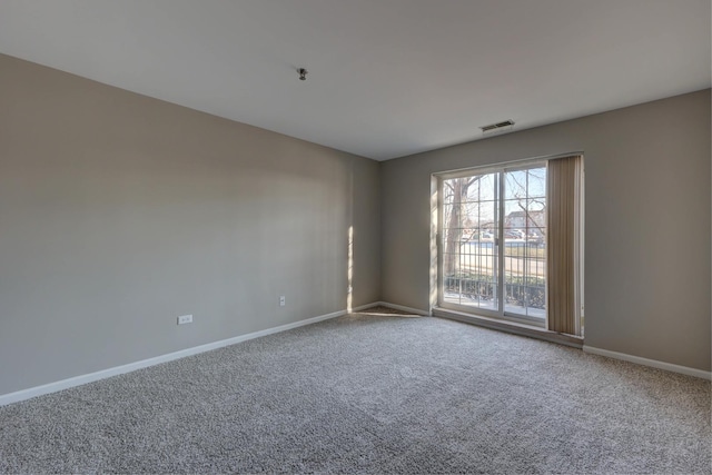 unfurnished room featuring carpet