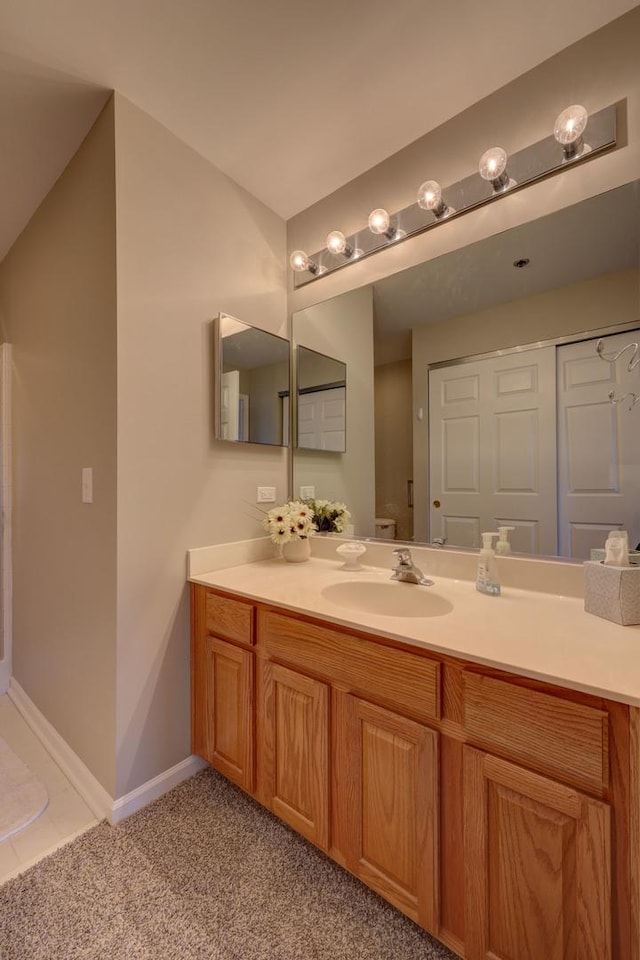 bathroom with toilet and vanity