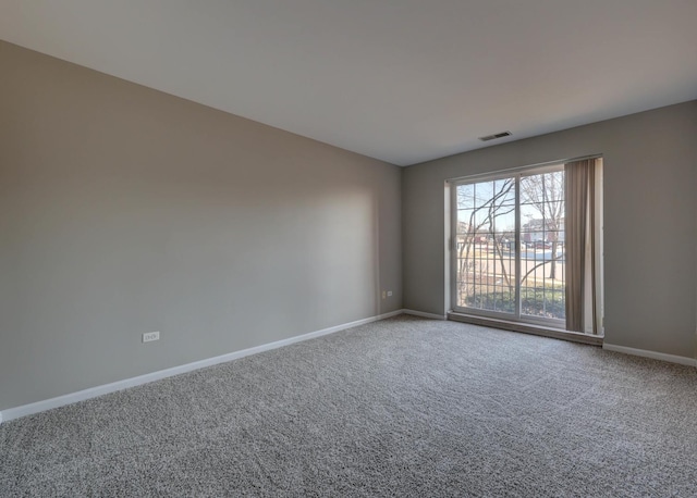 unfurnished room with carpet floors