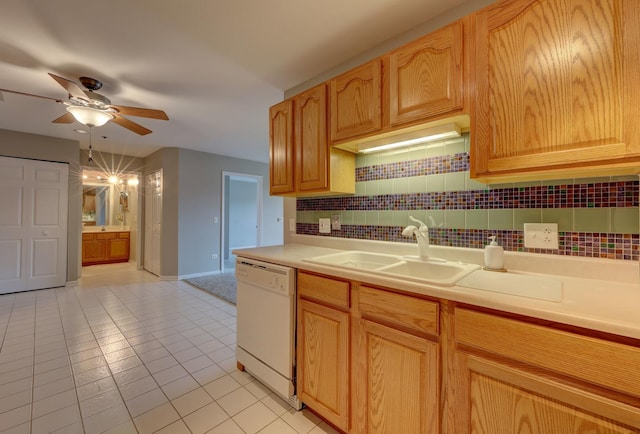 kitchen with dishwasher, light tile patterned floors, decorative backsplash, sink, and ceiling fan