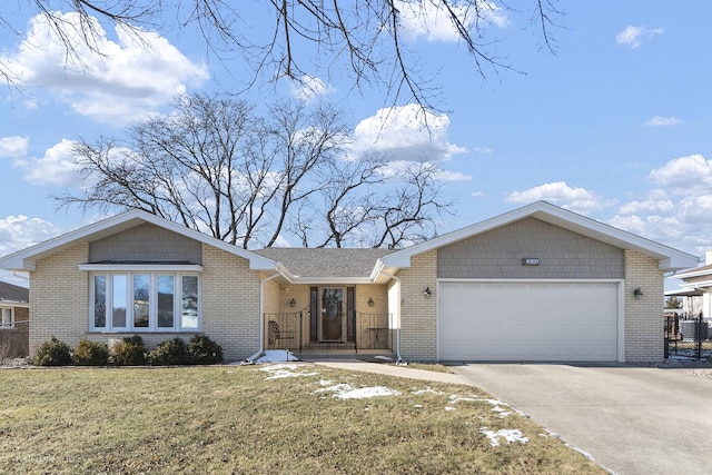 ranch-style home featuring a garage and a front lawn