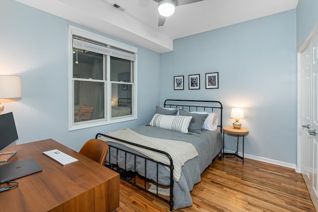 bedroom featuring ceiling fan and wood-type flooring