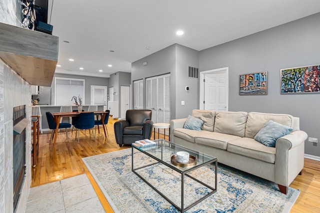 living room with light hardwood / wood-style floors