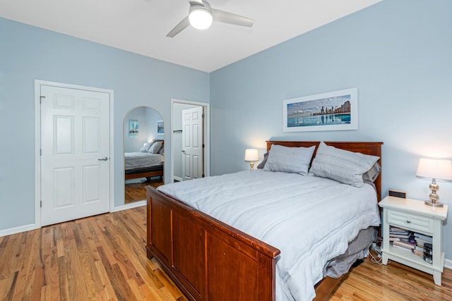 bedroom with ceiling fan and light wood-type flooring