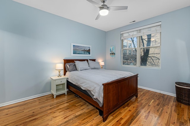 bedroom featuring wood-type flooring and ceiling fan