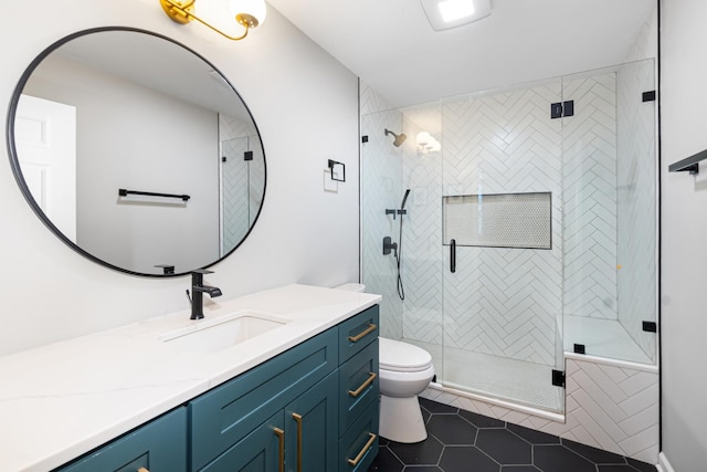 bathroom featuring vanity, toilet, tile patterned floors, and walk in shower