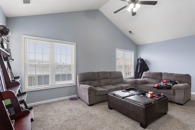 carpeted living room with high vaulted ceiling, a wealth of natural light, and ceiling fan