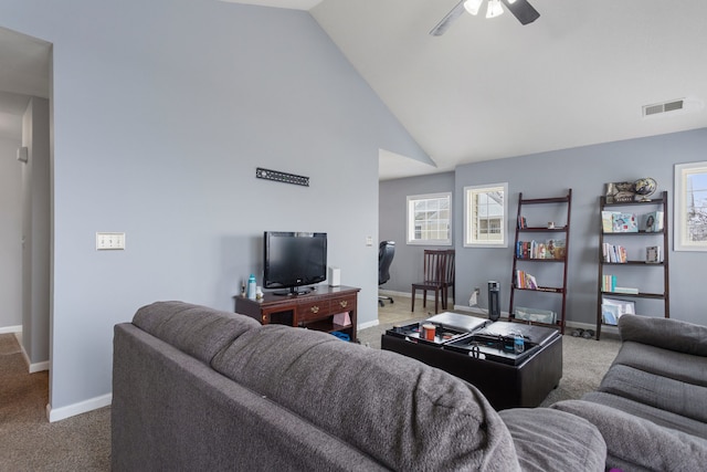 living room featuring ceiling fan, carpet flooring, and vaulted ceiling