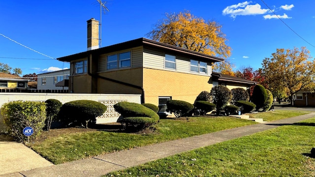 view of home's exterior featuring a lawn