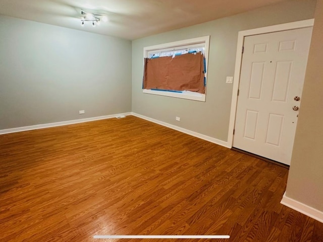 empty room featuring wood-type flooring