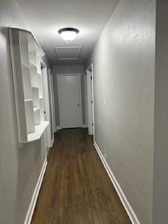 hallway with dark hardwood / wood-style floors