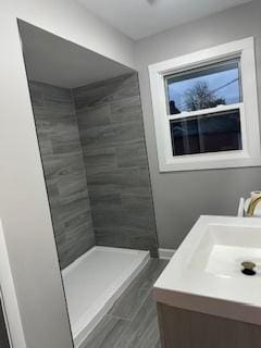 bathroom featuring vanity and walk in shower