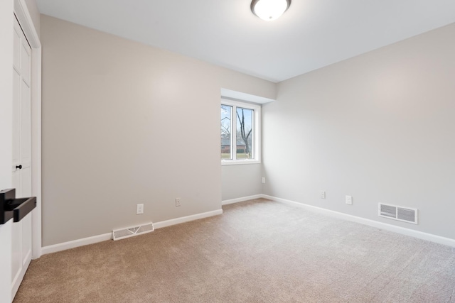 unfurnished bedroom featuring light colored carpet