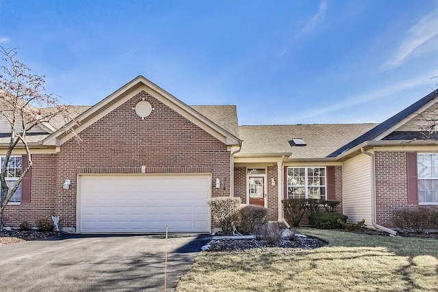 view of front facade with a garage and a front lawn