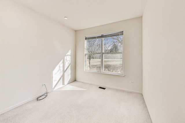 empty room with light colored carpet