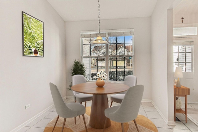 dining space featuring light tile patterned flooring