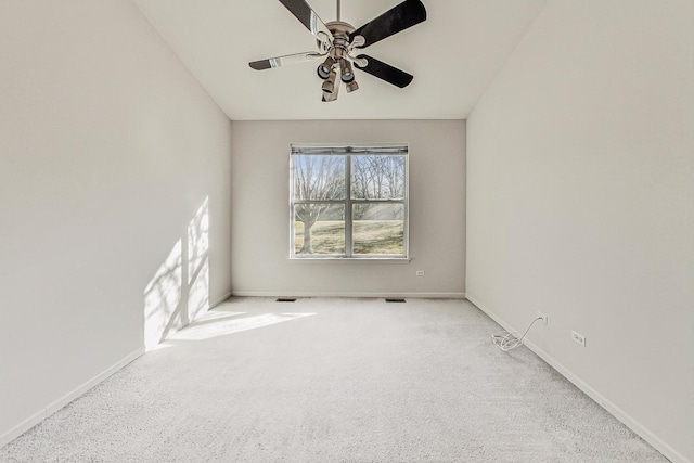 empty room with light colored carpet and ceiling fan