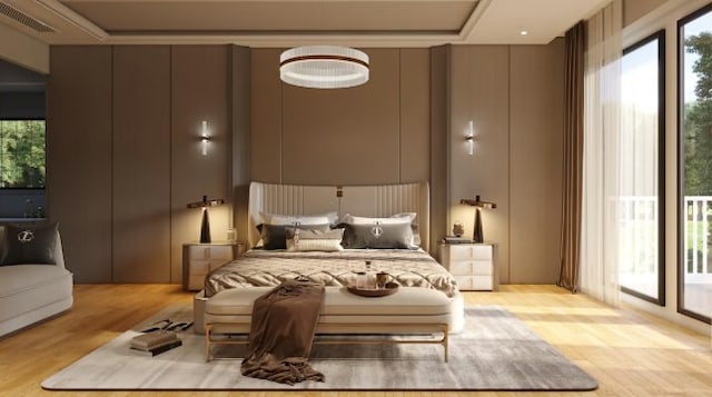 bedroom with light wood-type flooring and access to exterior