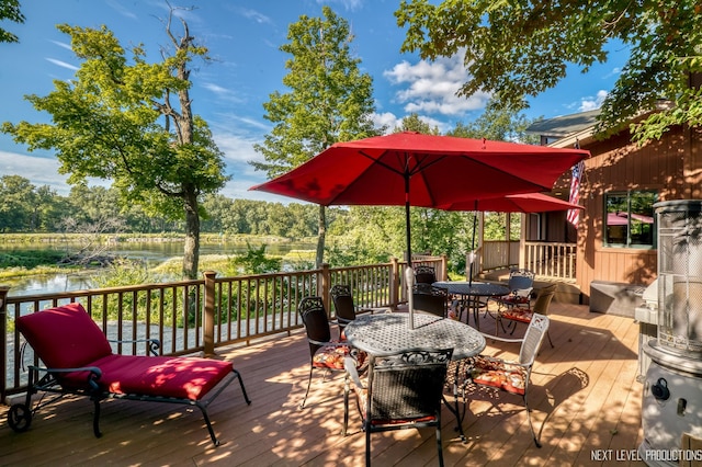 wooden deck with a water view