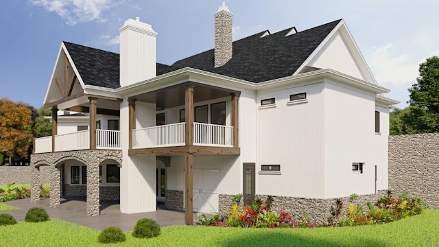 rear view of house with a balcony and a patio