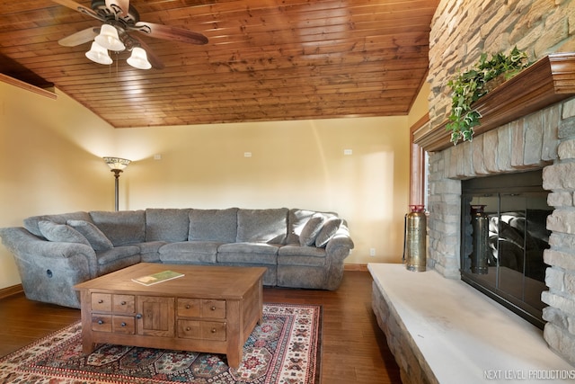 living room featuring ceiling fan, a stone fireplace, wood ceiling, vaulted ceiling, and dark hardwood / wood-style floors