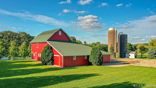 view of outbuilding featuring a yard